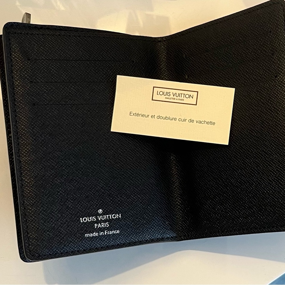 Louis Vuitton Black/Brown wallet slot of storage. Highly collectible piece